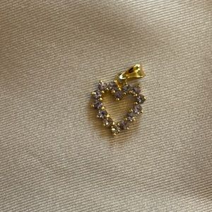 14k gold heart shaped charm with purple gems